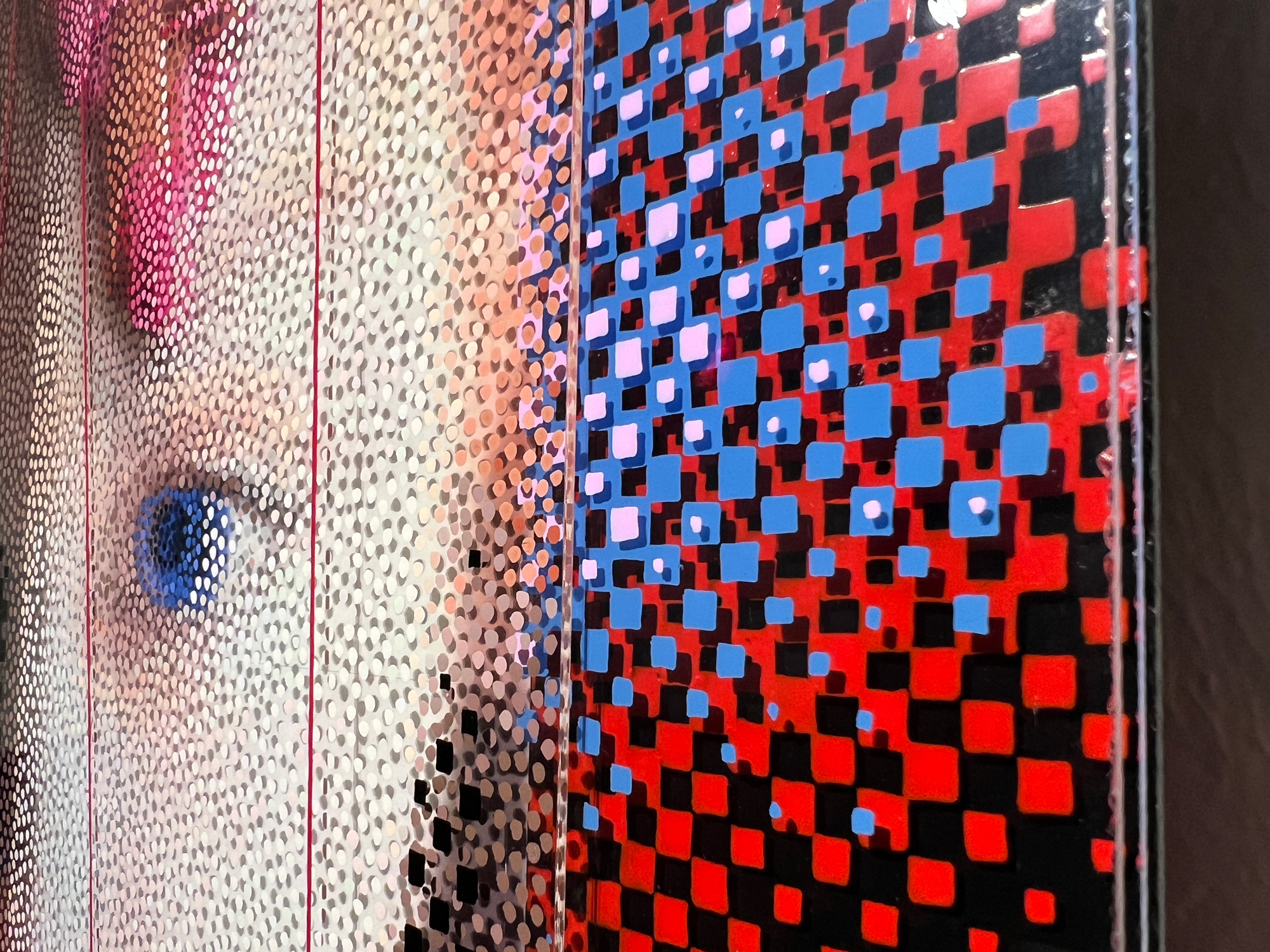 One Race – Detail of layered plexiglass with red, blue, and black squares