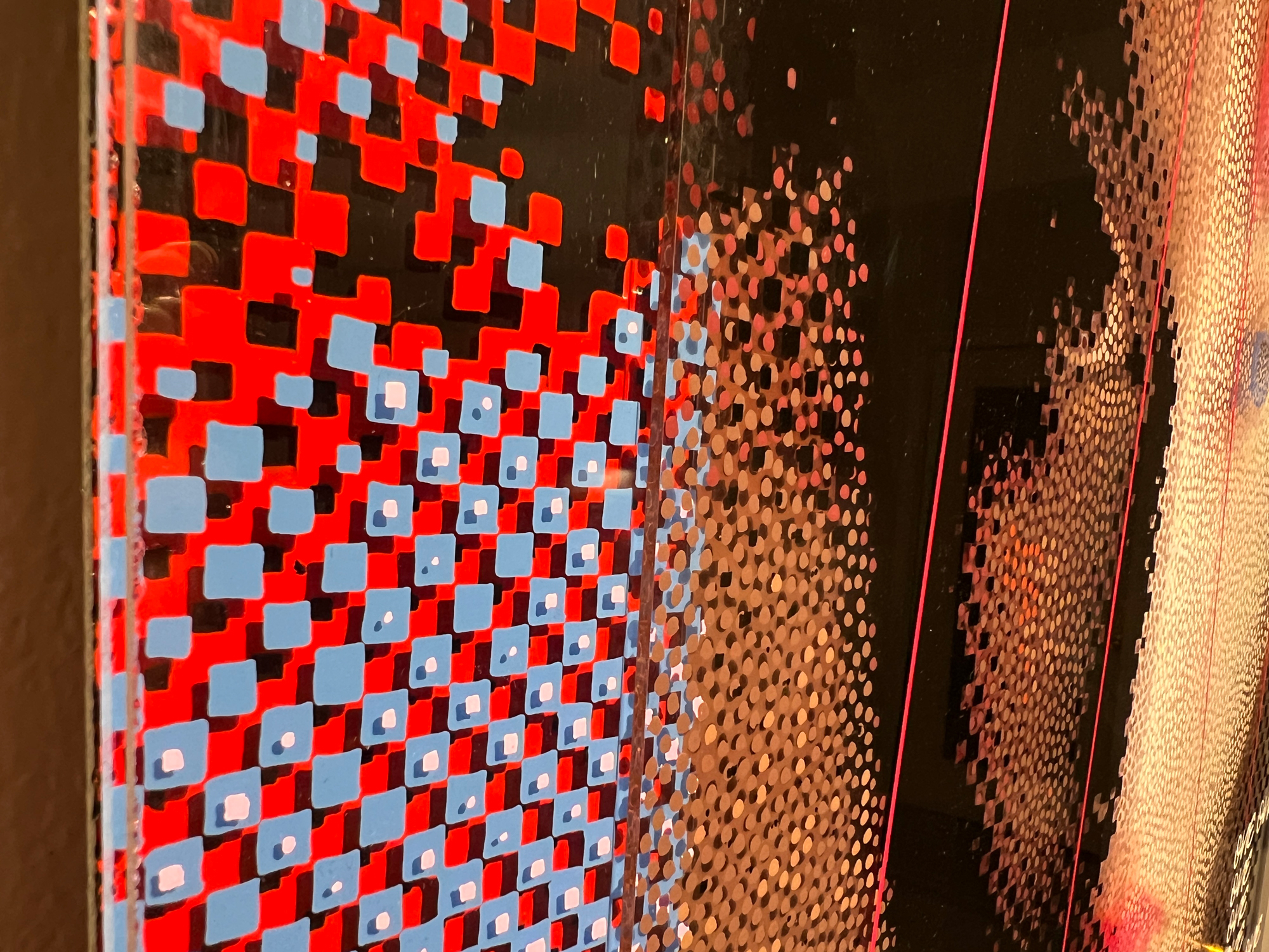 One Race – Side detail of red and blue square pattern on layered plexiglass