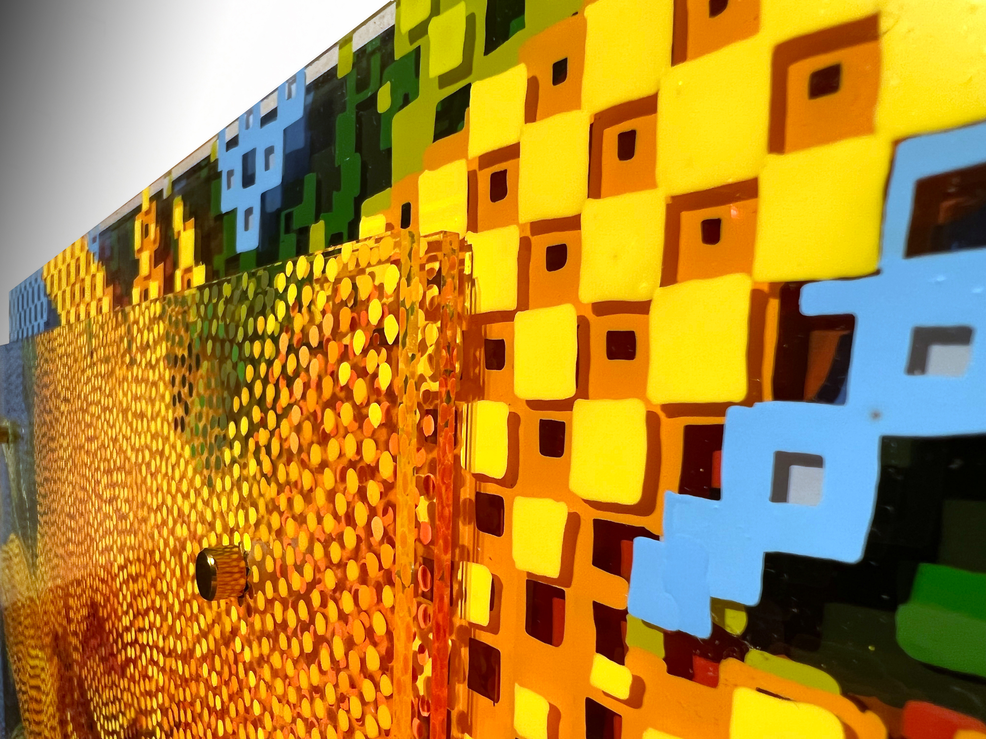Rise And Shine – Angled view of plexiglass layers, mounting post, and yellow graphic squares