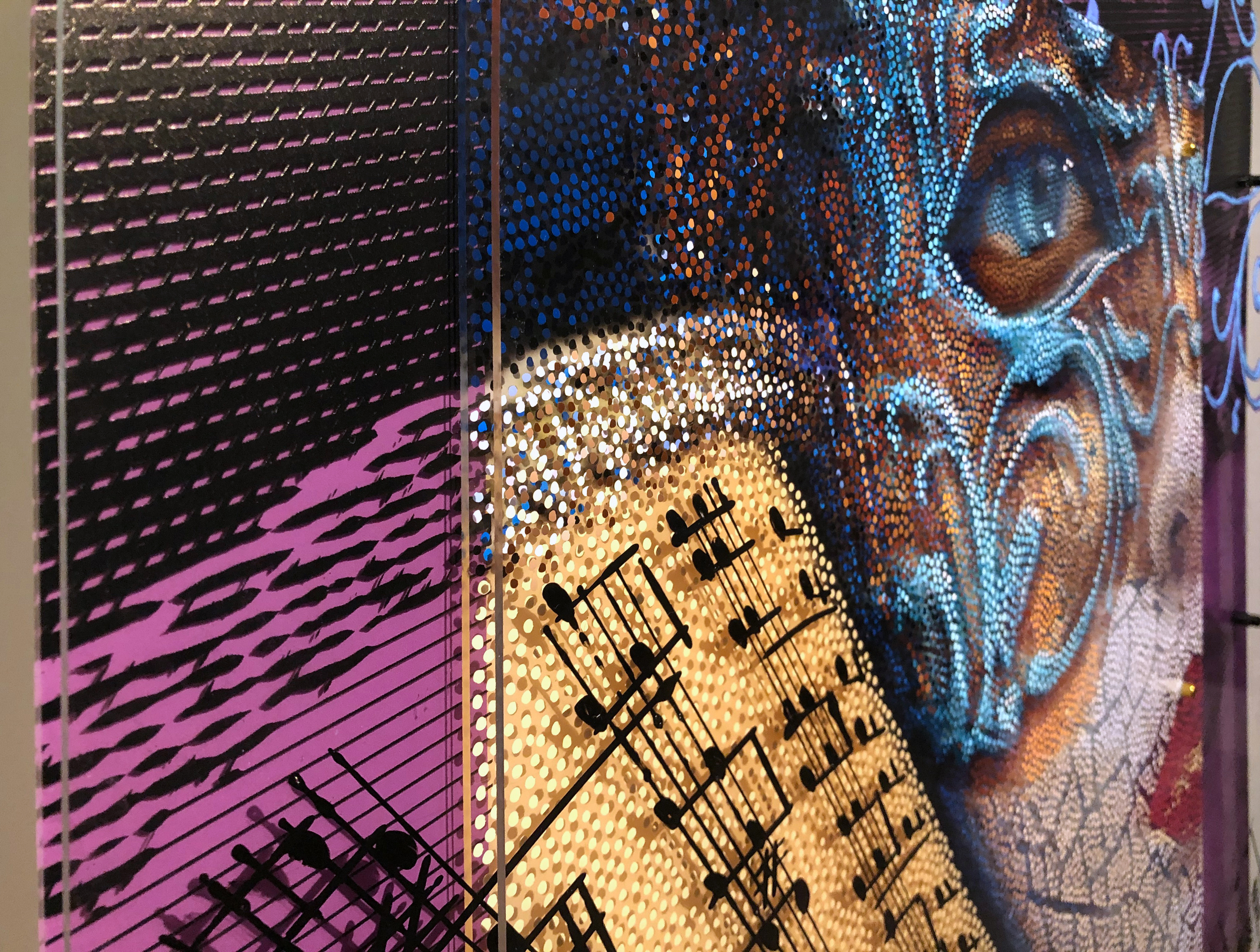 Volto Musica – Detail of musical notation and layered portrait on plexiglass