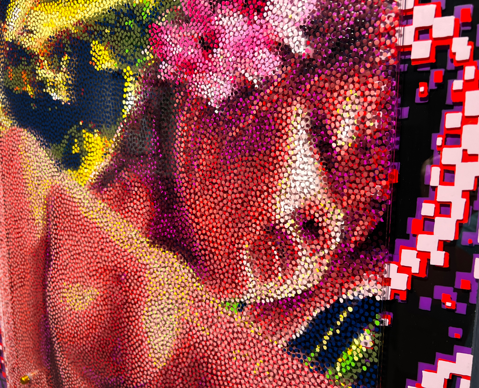 Echoes of Gauguin – Close-up of face in Neo-Pointillist dots beside graphic border