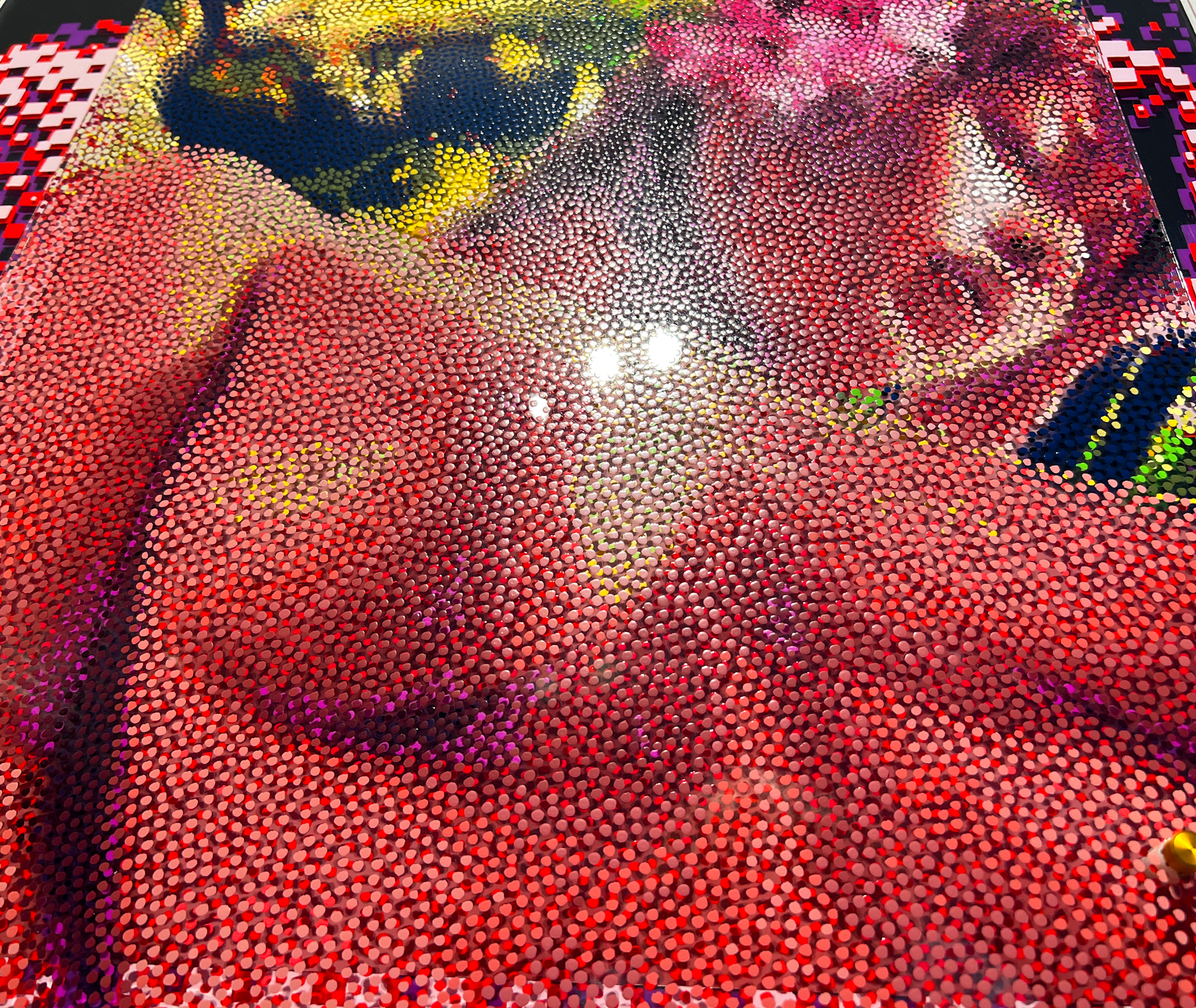 Echoes of Gauguin – Angled view of glossy layered dots across the portrait