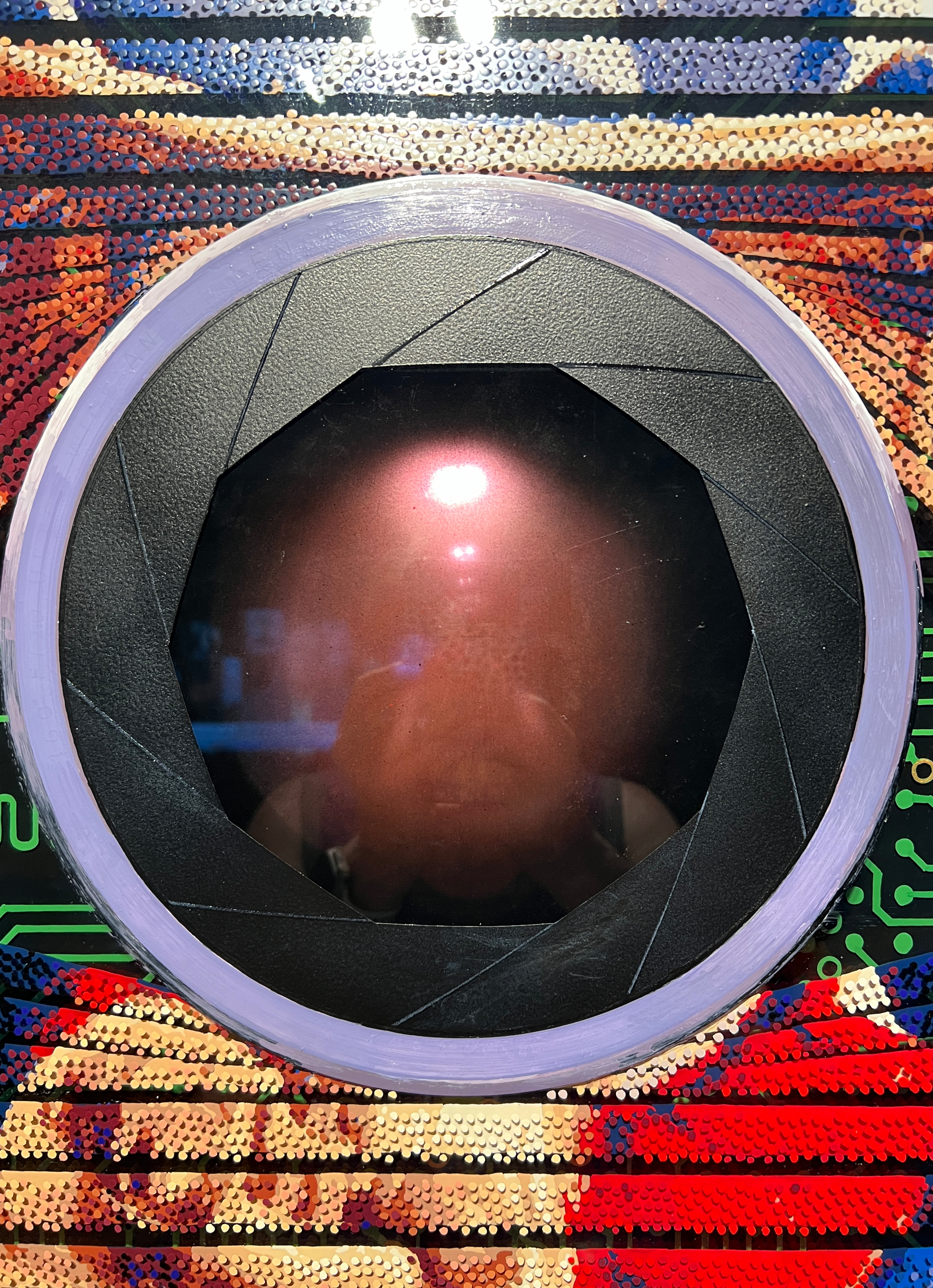 Oz – Detail of the central camera lens motif