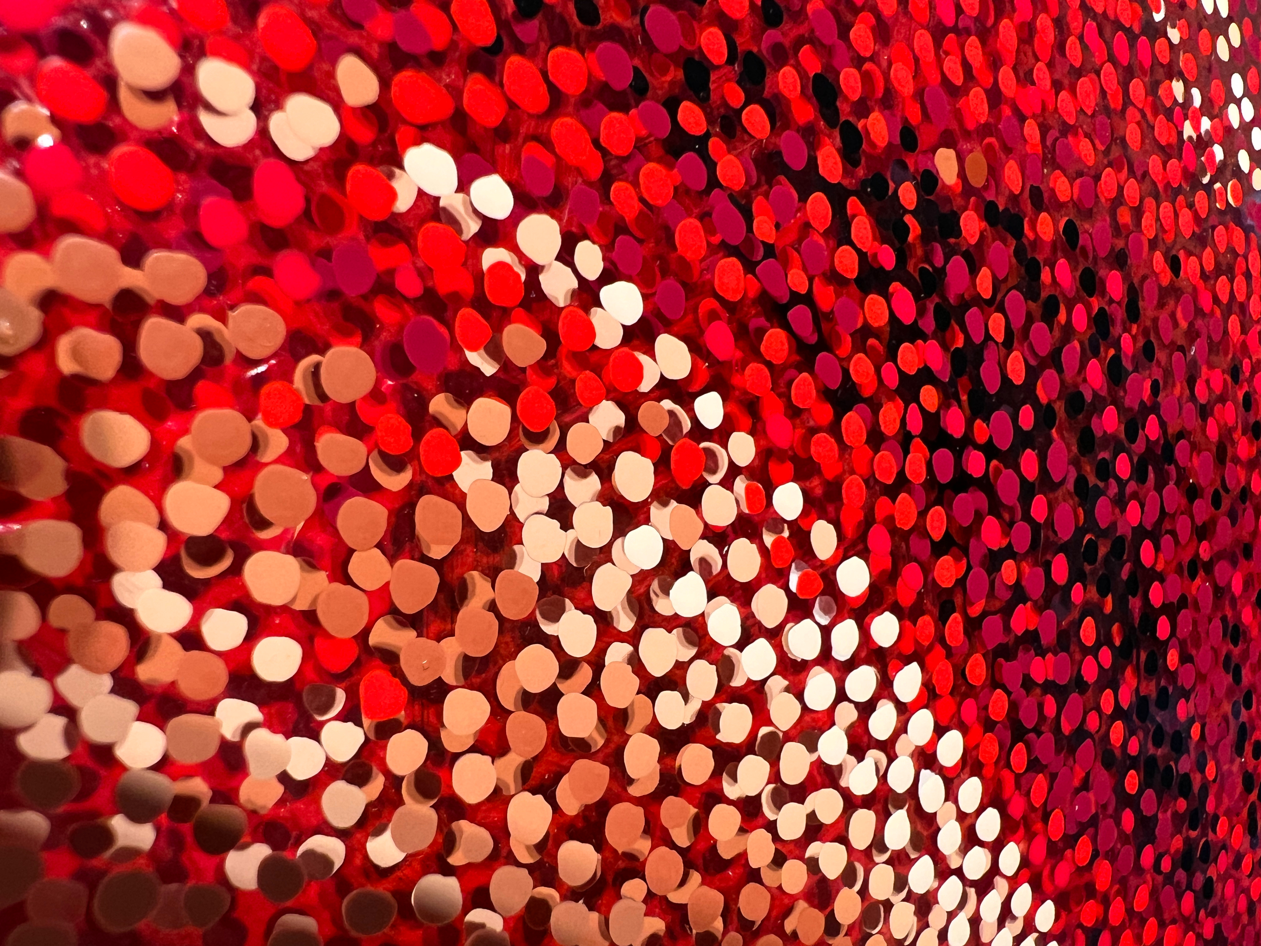 Red Sky Dancer – Close-up of red, white, and peach Neo-Pointillist dots on plexiglass