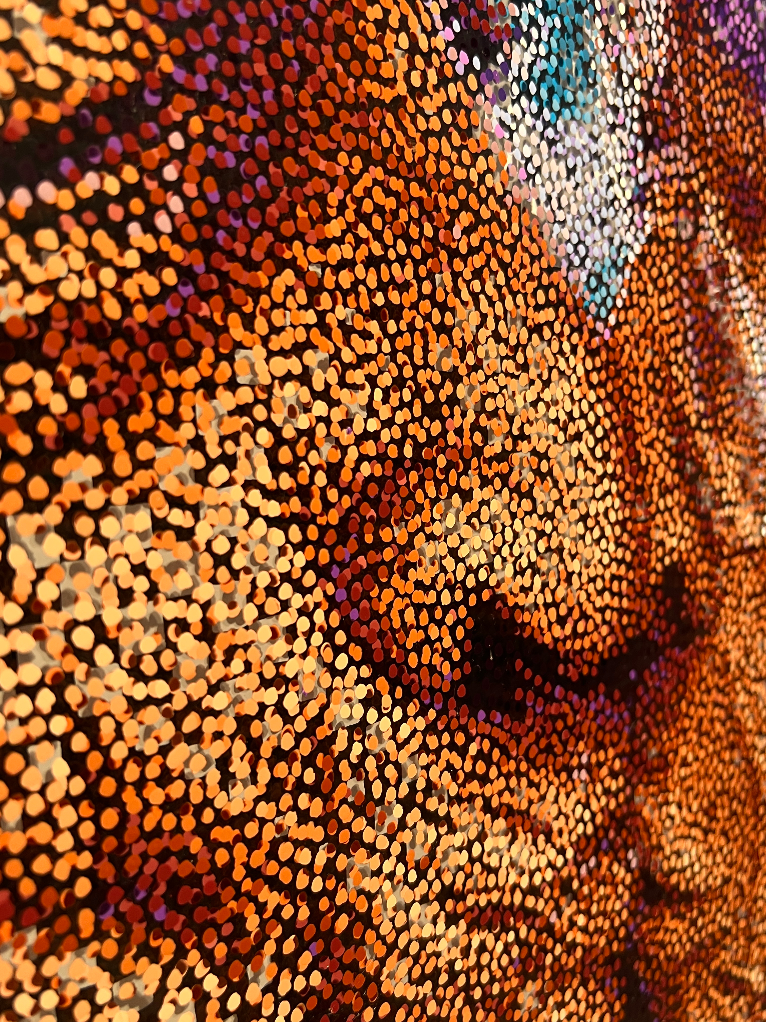 Smooch – Close-up detail of orange and purple Neo-Pointillist dots on plexiglass